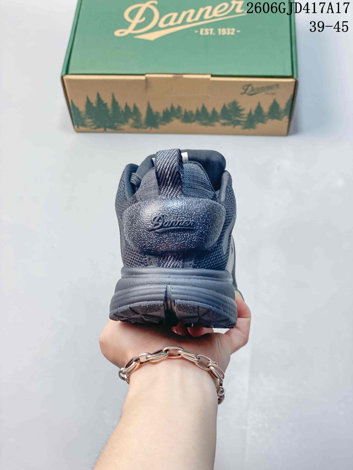 Rear view of a dark gray shoe showing the heel and pull loop.