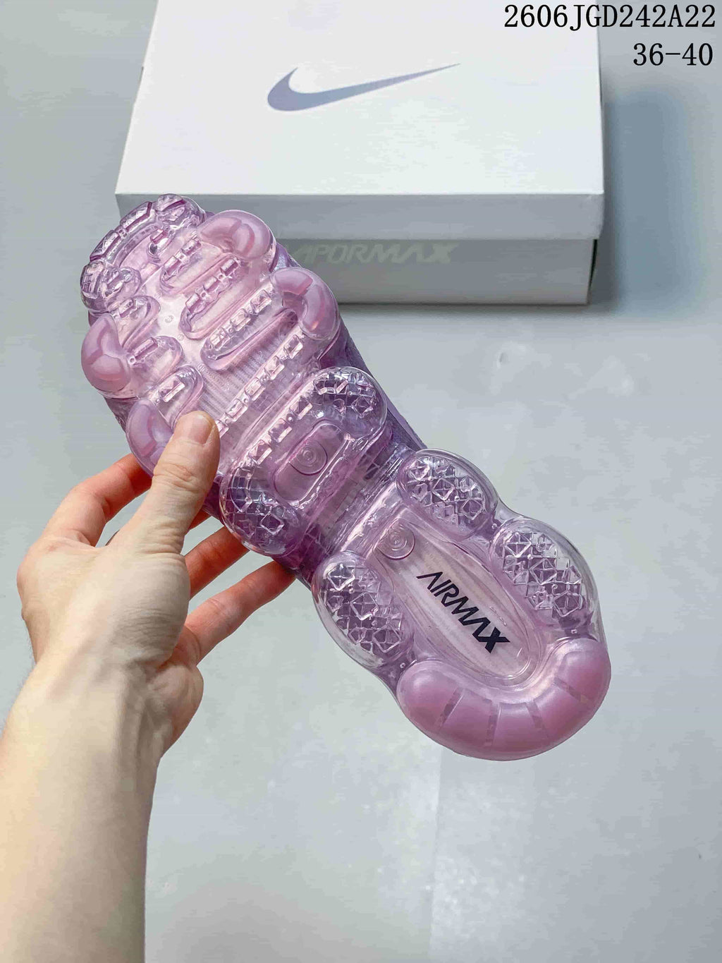 Underside view of the purple sneakers showing a transparent segmented sole; image displays the size range 36–40.