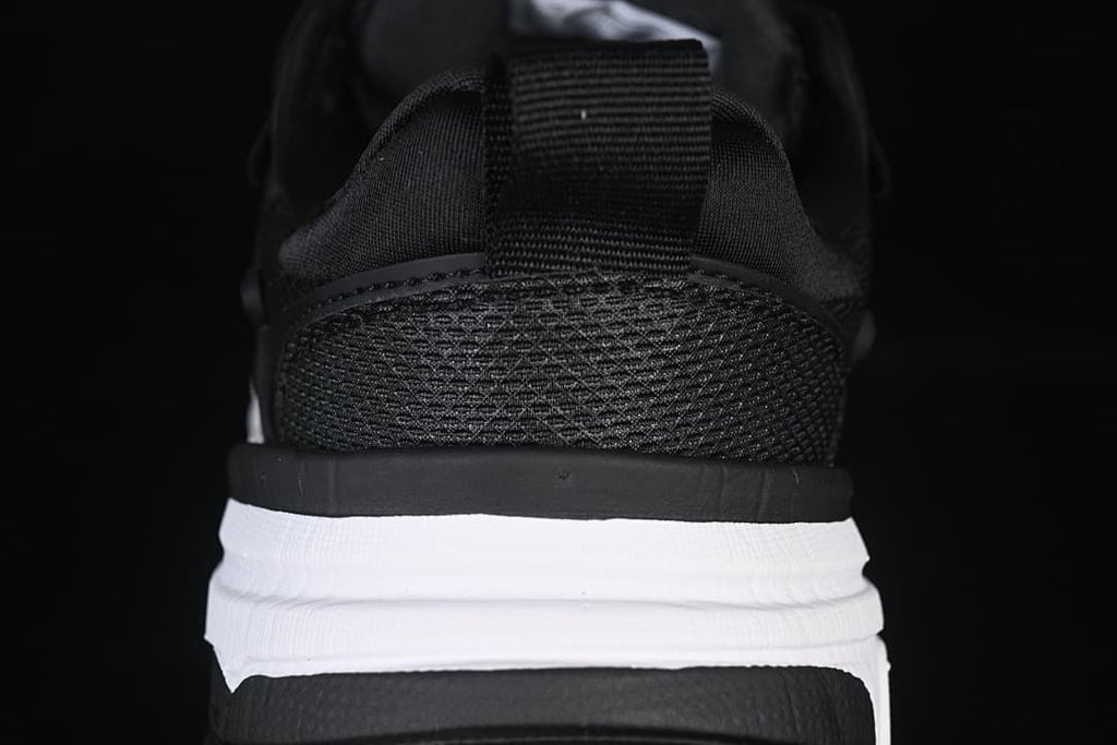 Rear view highlighting the mesh heel and layered sole.