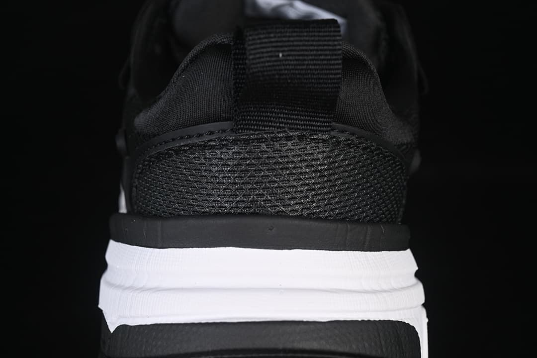 Rear view highlighting the mesh heel and layered sole.