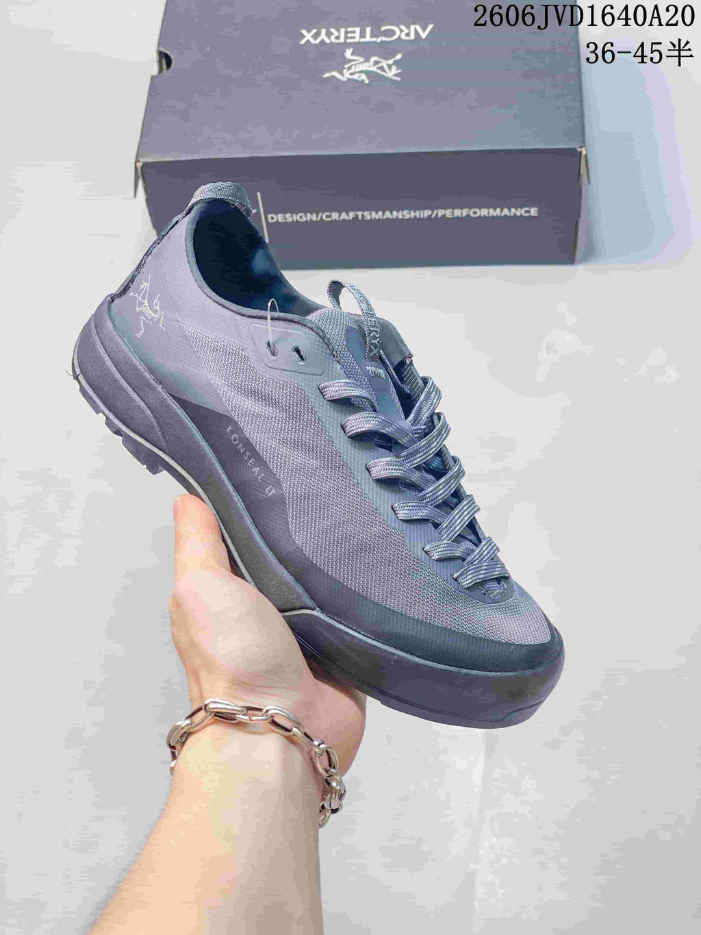 Gray and muted blue Arc'teryx Konseal LT trail shoe shown from the side.