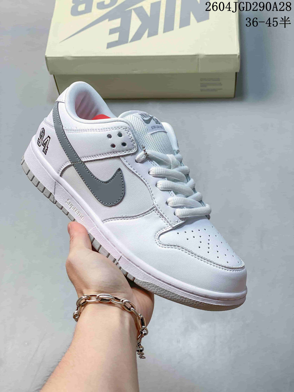 White low-top sneaker with gray accents and white laces
