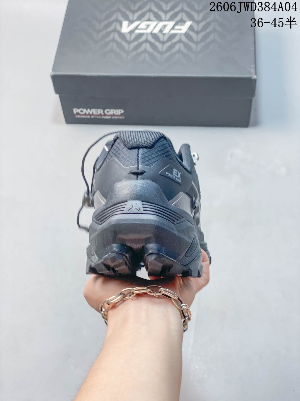 Rear view of a gray KAILAS FUGA EX3 shoe with its rugged heel outsole