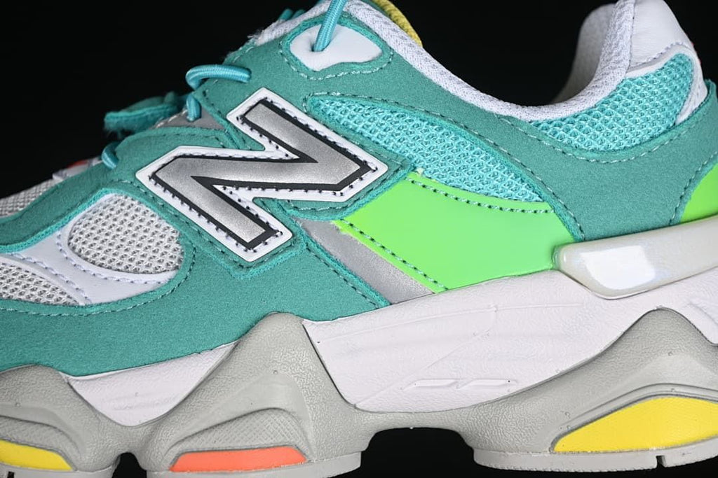 Close-up of the side logo, mesh panels, teal overlays, and lime accent