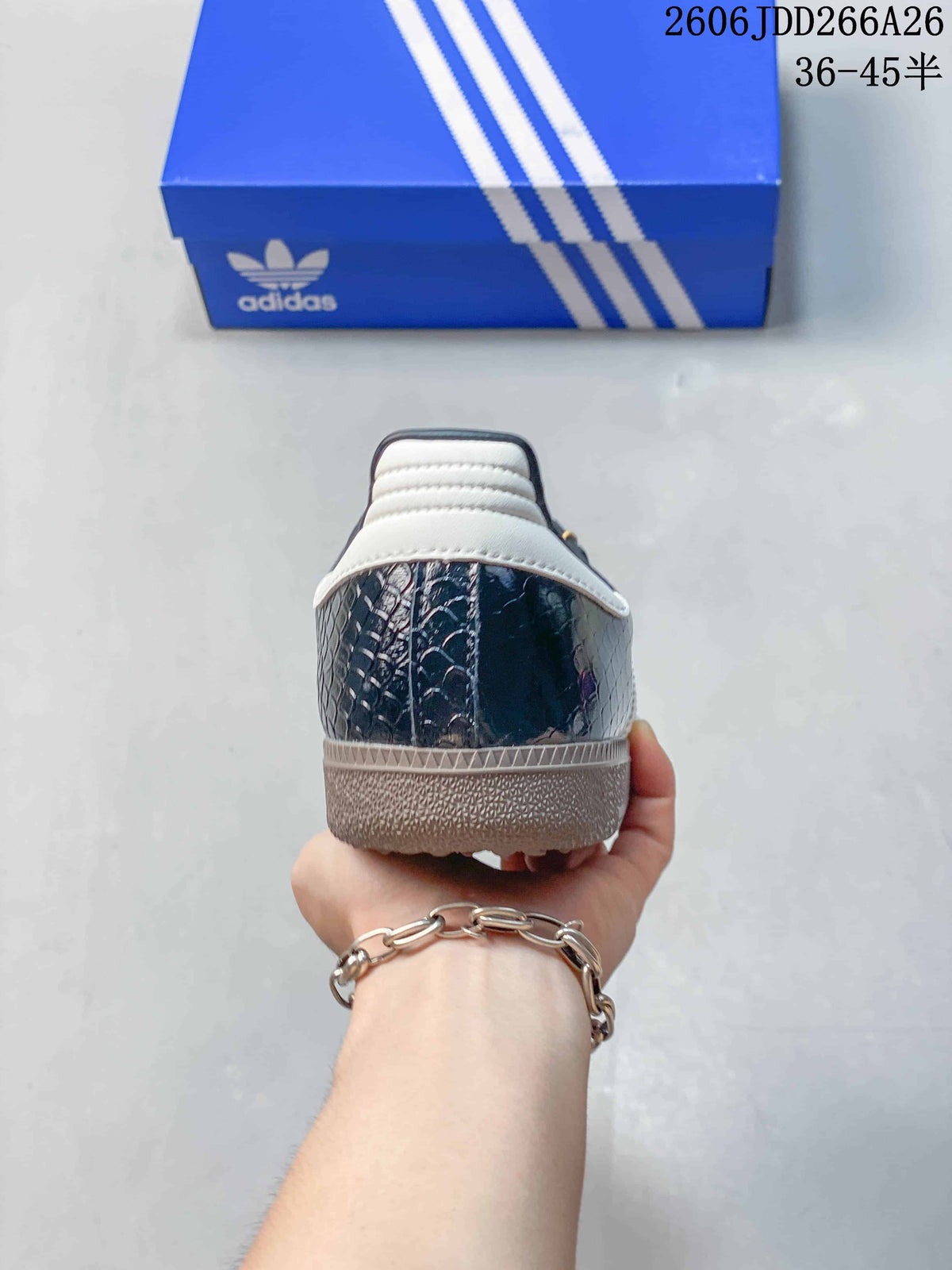 Rear view showing the patterned dark upper, white heel detail, and gum-tone outsole.