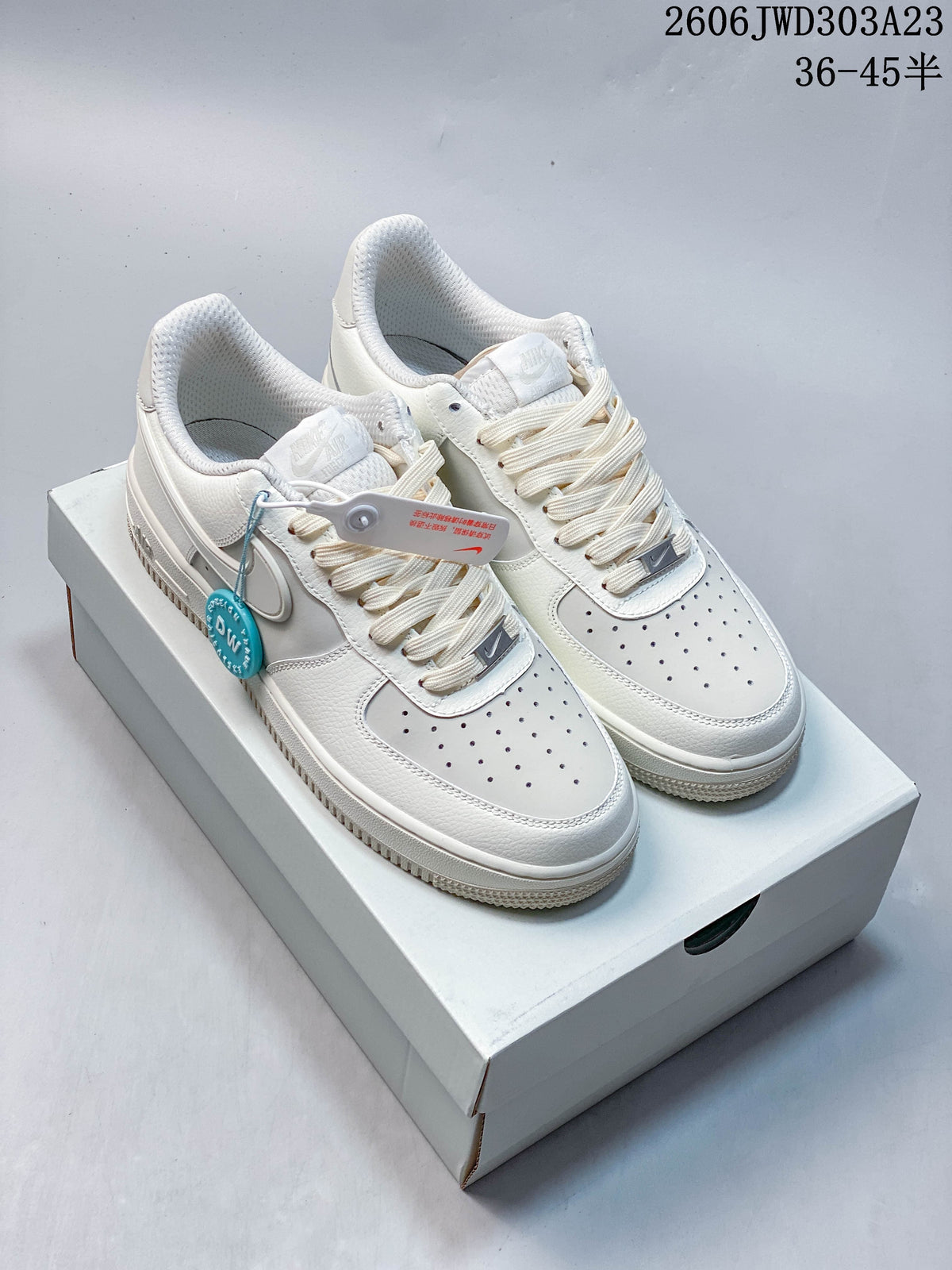 Pair of white Nike Air Force 1 low-top sneakers on a shoebox