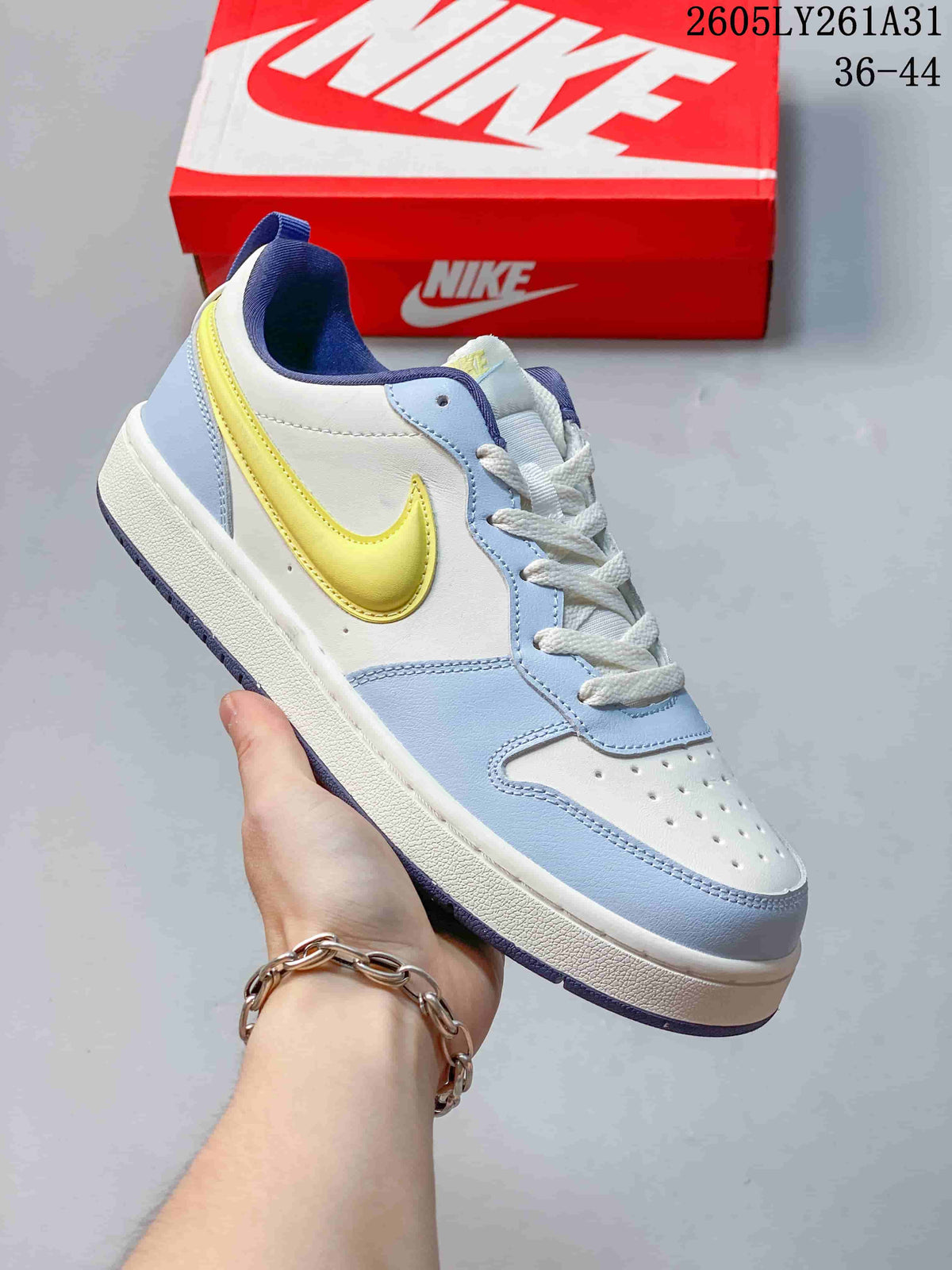 Angled view of the NikeCourt Borough Low Essential+ sneaker highlighting its color-blocked upper