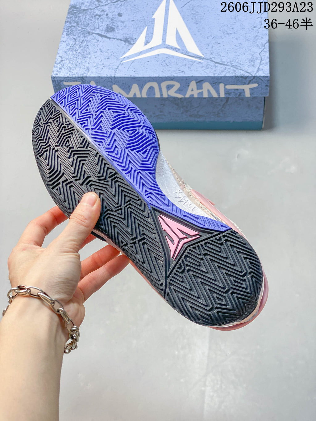 Underside view of the Nike Ja 1 EP shoe showing its patterned black and blue outsole.