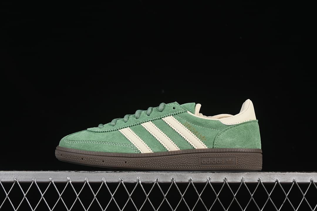 Side profile of green adidas Handball Spezial sneakers with cream stripes and dark brown sole