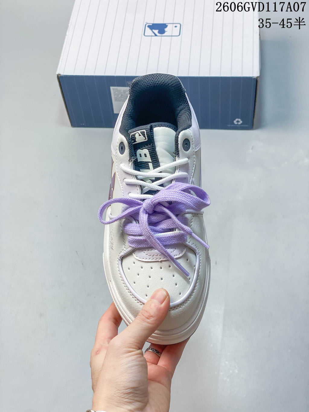 Top view of the sneaker showing its perforated toe and lavender laces