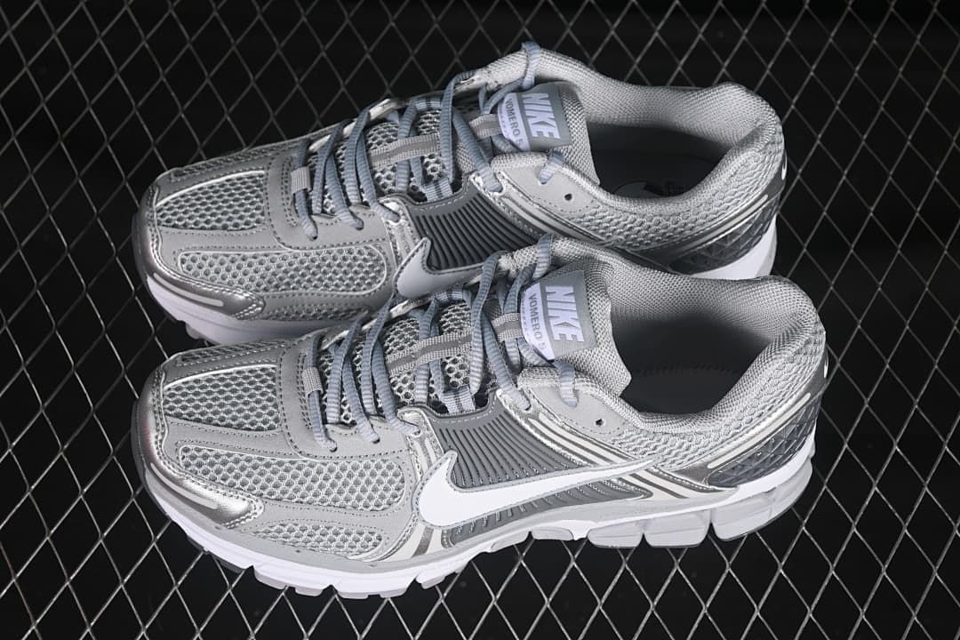 Pair of silver and grey Nike Zoom Vomero 5 SP sneakers