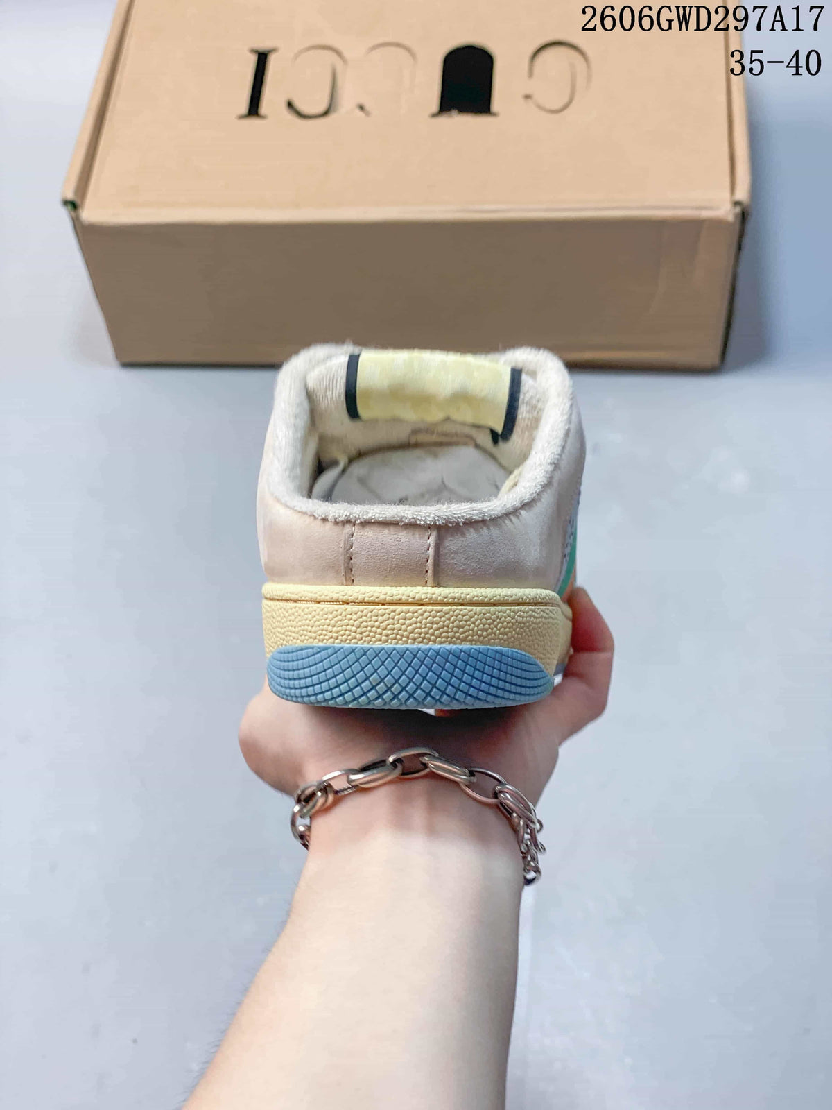 Rear view showing the heel and layered sole of a beige and blue sneaker