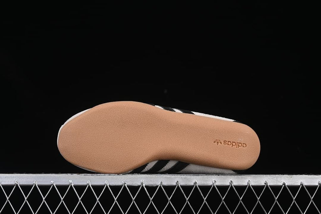 Underside view of the gum-colored outsole