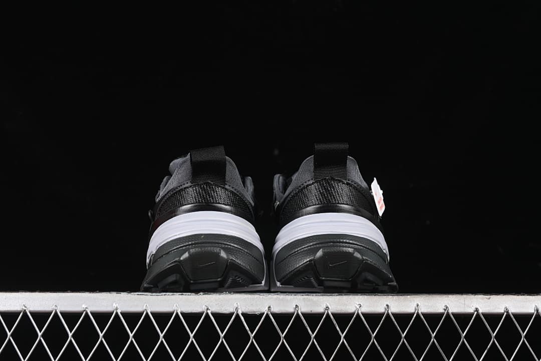 Rear view of both sneakers showing heel details and outsoles