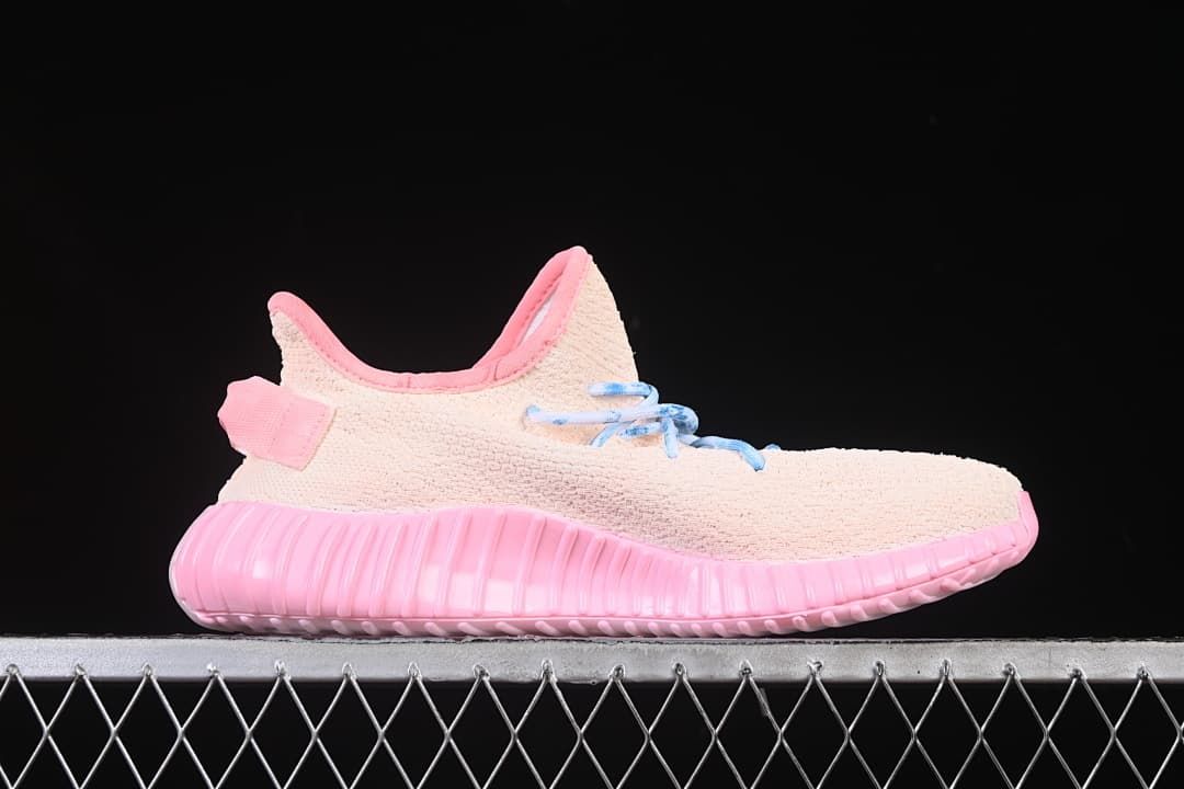 Side profile showing the pink ribbed sole and pale pink upper.