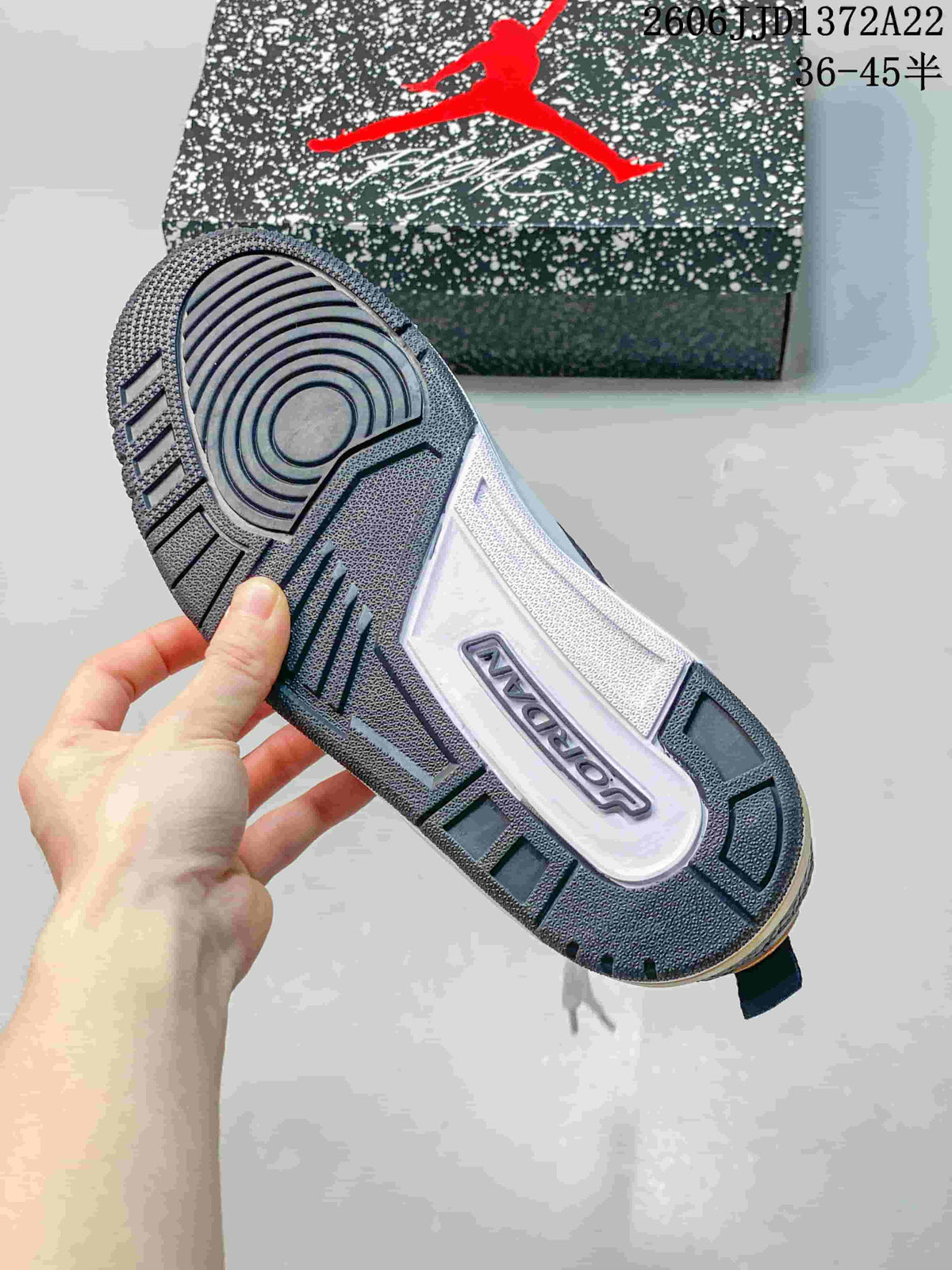 Close-up of the sneaker outsole showing its patterned tread