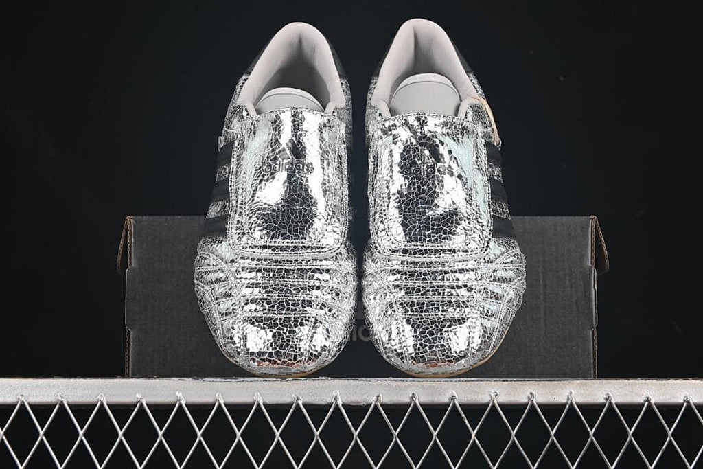 Front view of the pair showing wide forefoot straps and silver patterned uppers.