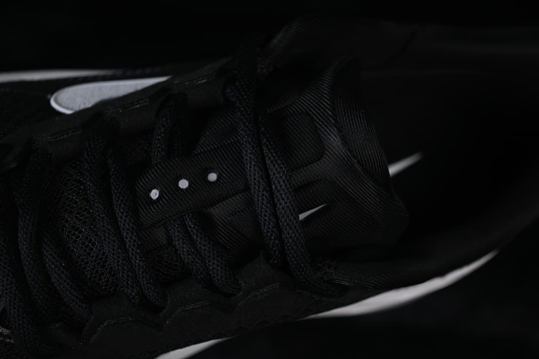Close-up of the black laces and lace area.
