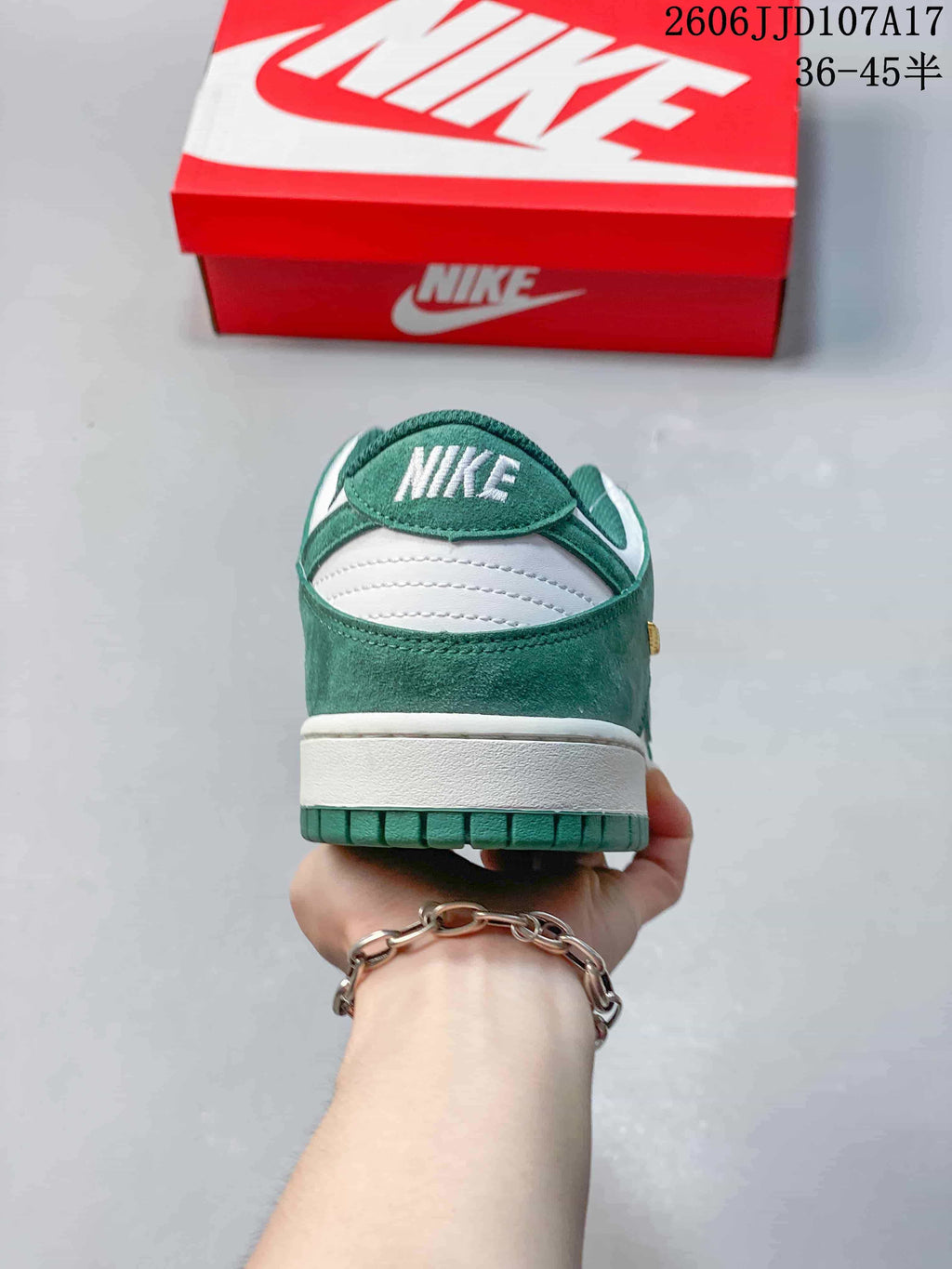 Rear view showing the green heel and white midsole