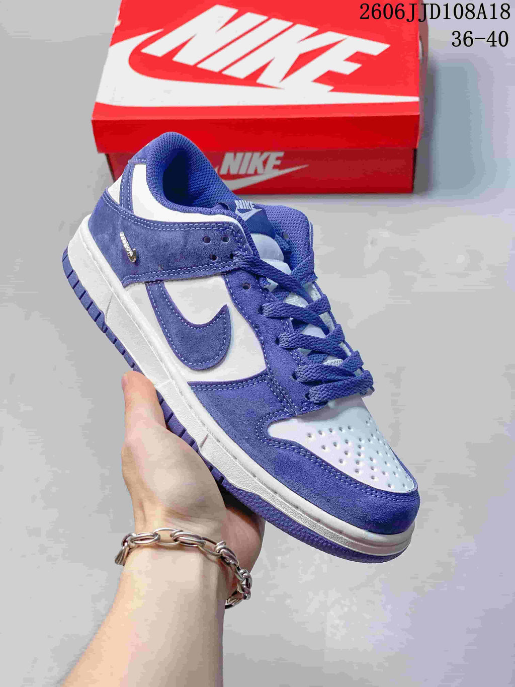 Angled side view of a purple and white Nike SB Dunk Low Pro sneaker.