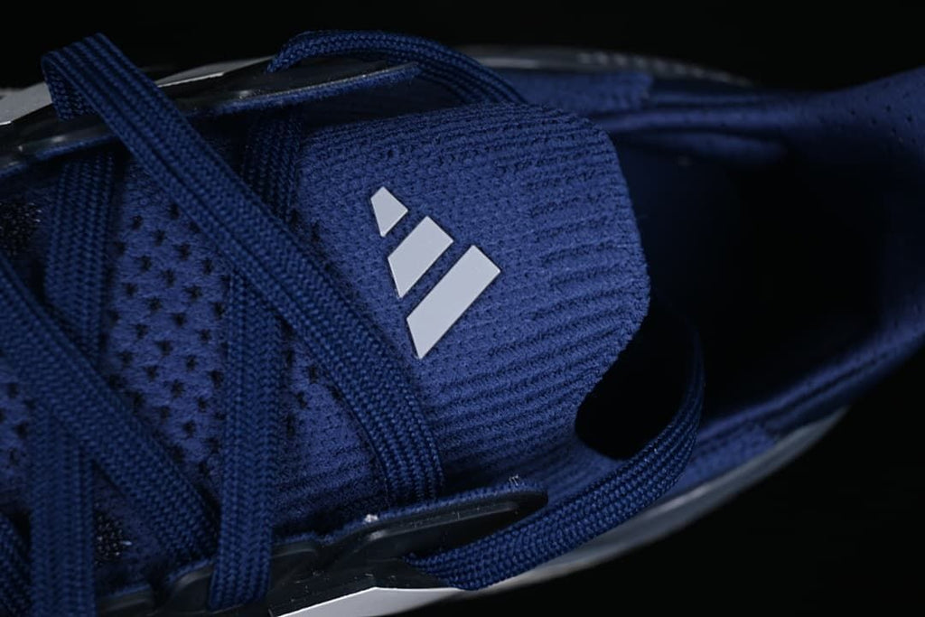 Close-up of the blue tongue, laces, and adidas logo.