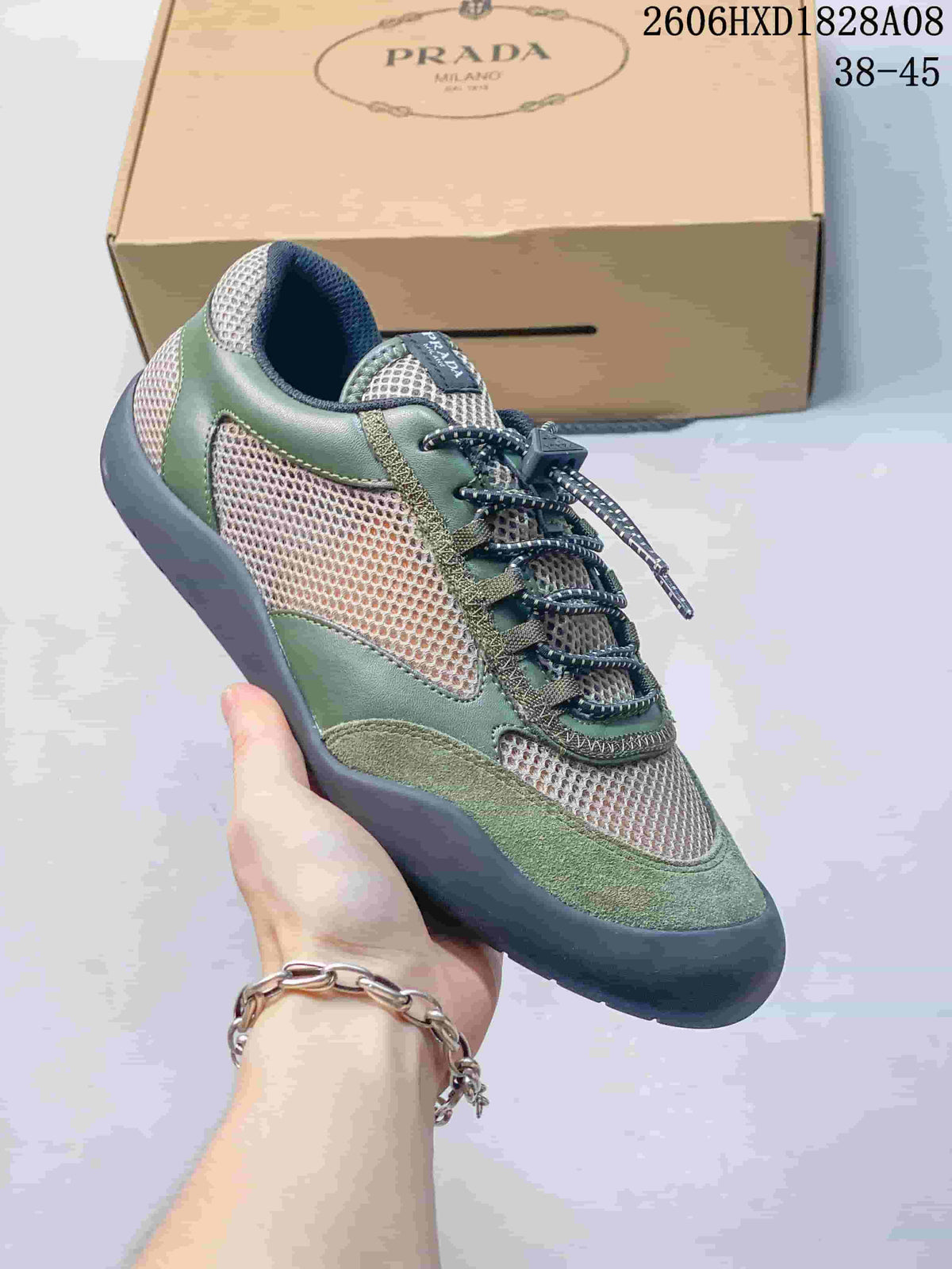 Angled view of the green and beige trainer with mesh panels and patterned laces.