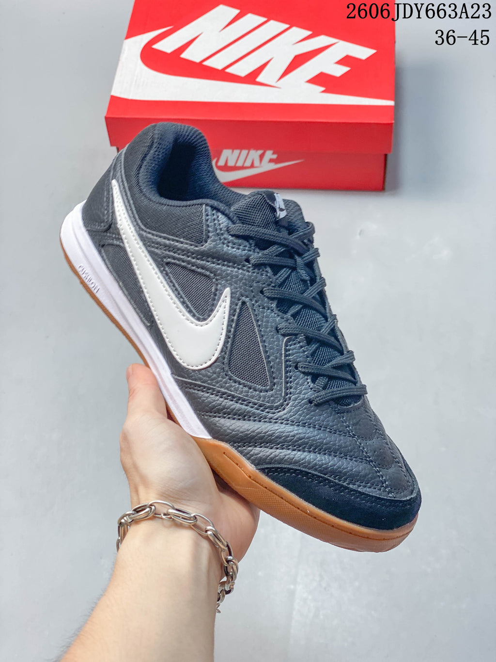 Close-up of a dark gray Nike Gato sneaker with a white side accent