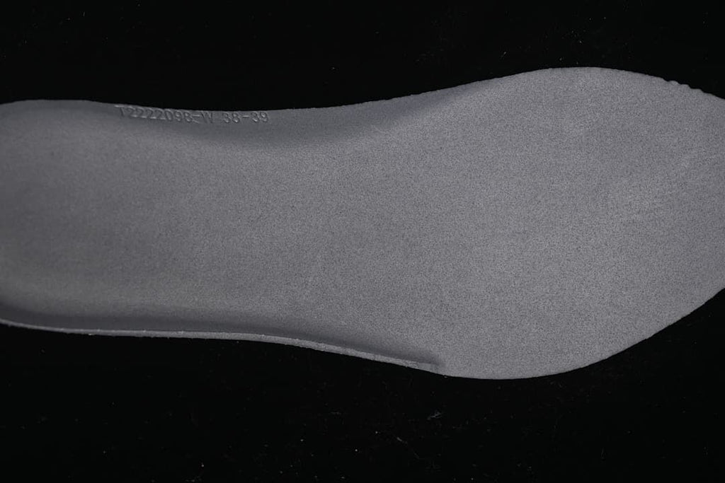 Close-up of the textured insole with faint embossed markings.
