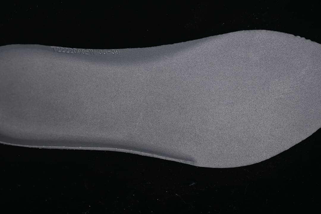 Close-up of the textured insole with faint embossed markings.