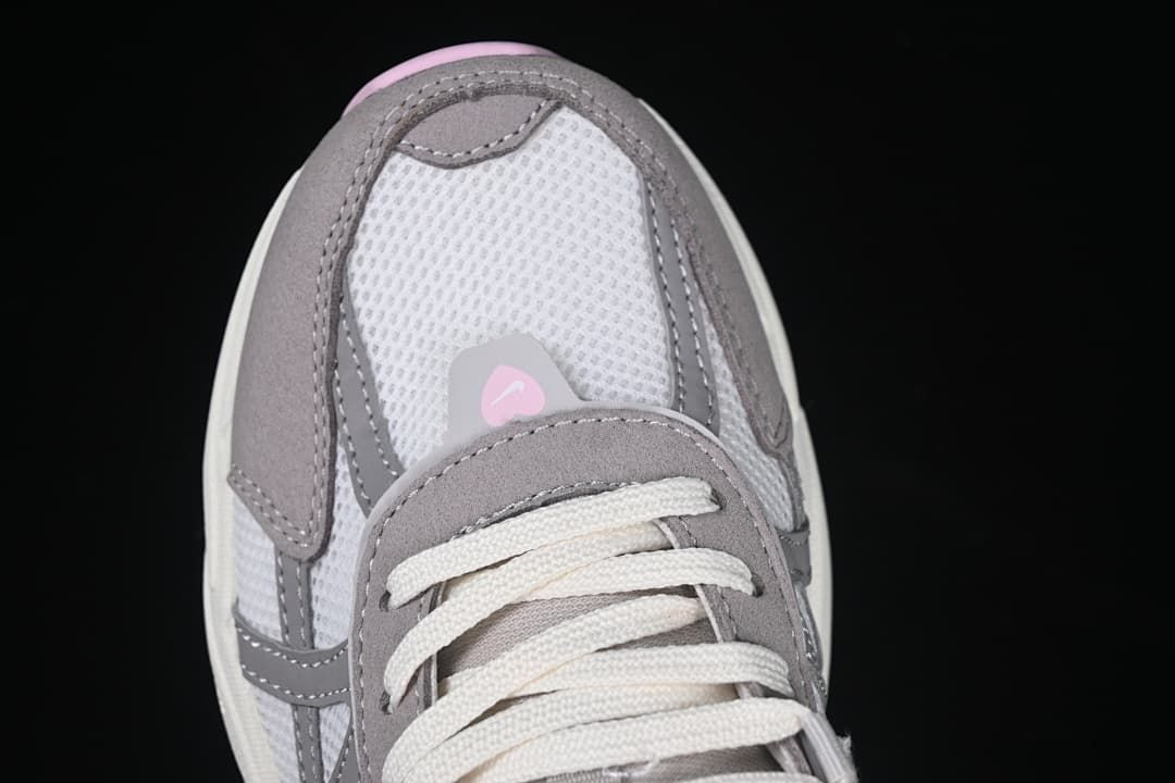 Top-down close-up of the sneaker toe and laces