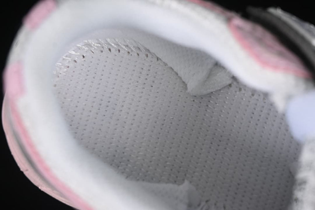 Close-up view inside the kids’ sneaker showing the padded lining.