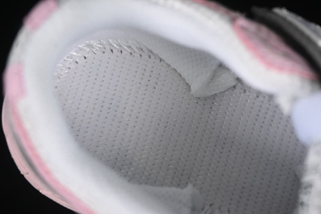 Close-up view inside the kids’ sneaker showing the padded lining.