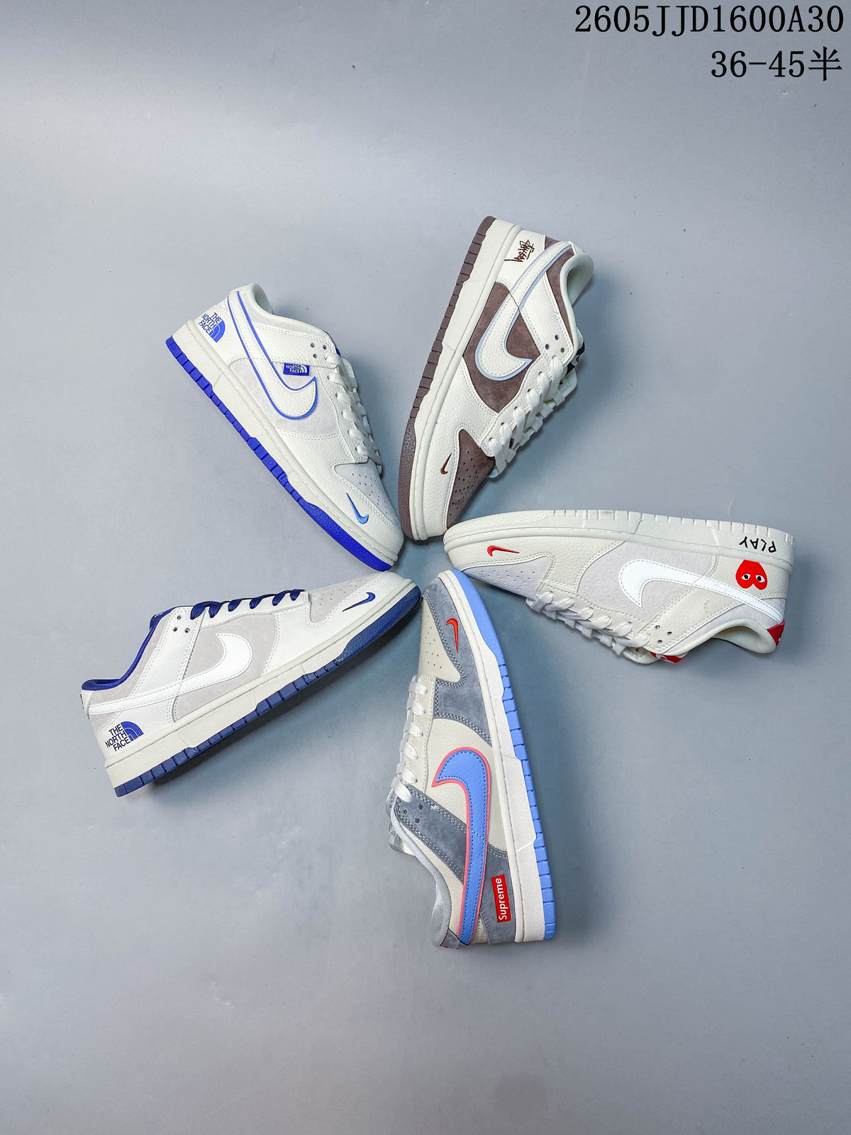 Several white-based low-top sneakers arranged together, showing different color combinations