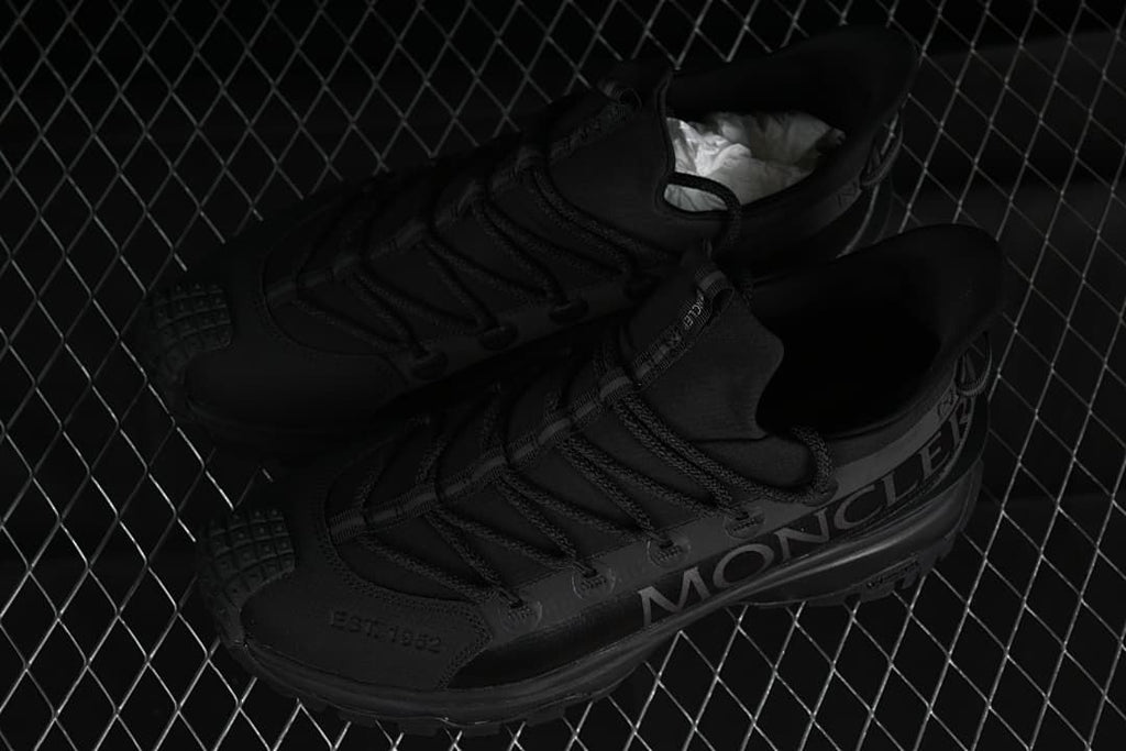 Pair of black Trailgrip Lite 2 sneakers shown from above