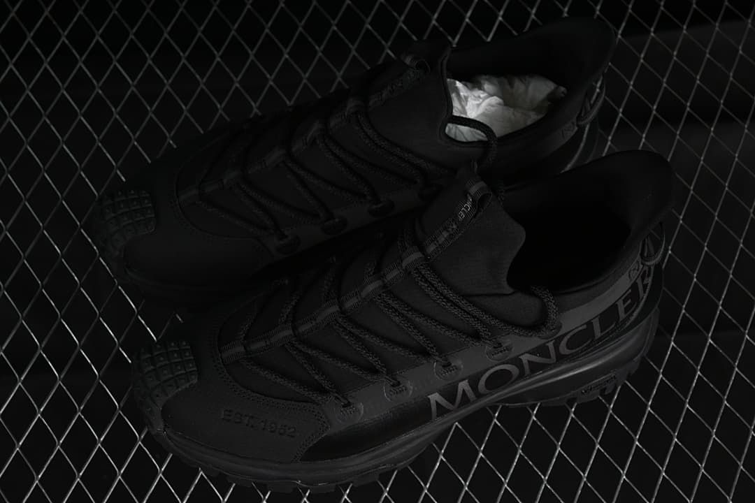Pair of black Trailgrip Lite 2 sneakers shown from above