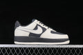 Side view of an off-white and dark gray low-top sneaker