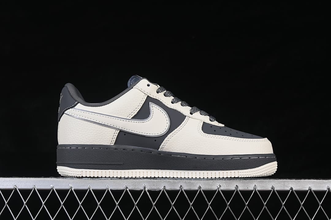 Side view of an off-white and dark gray low-top sneaker
