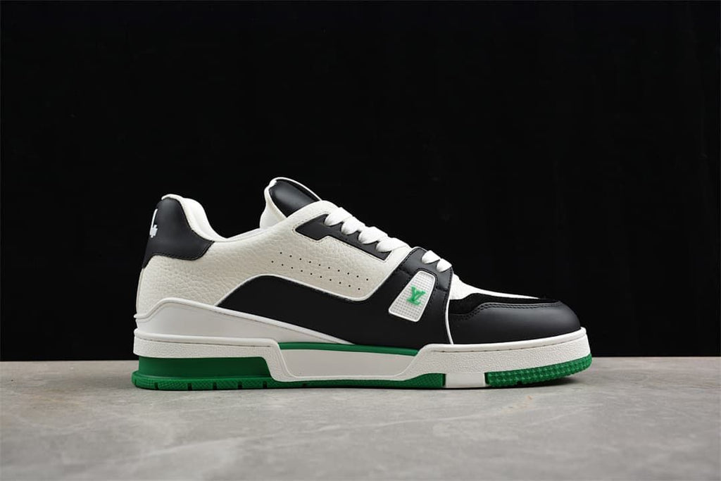 Side profile of the LV Trainer sneaker with white, black and green color blocking.