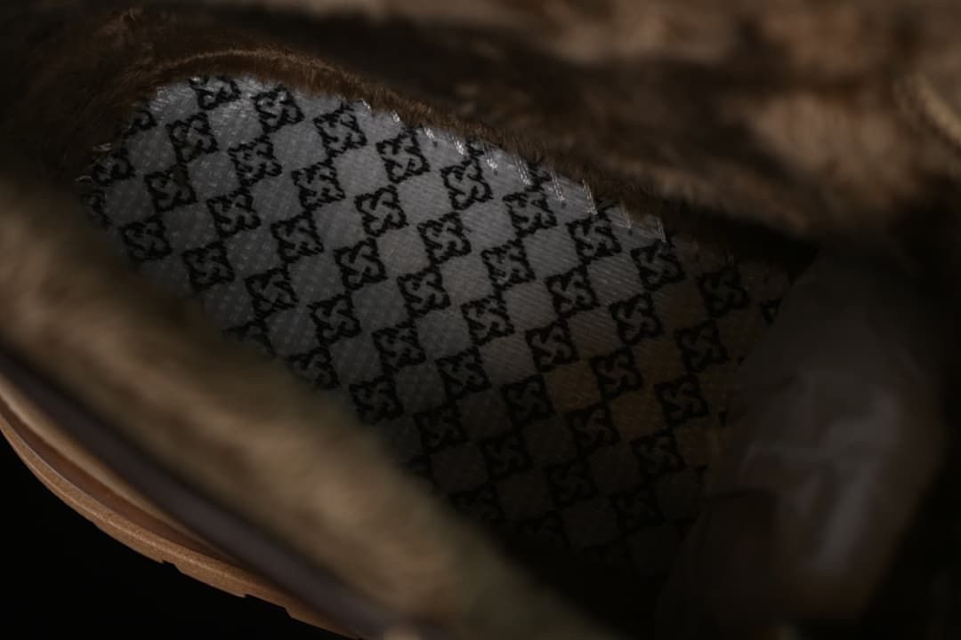 Interior close-up of the boot with patterned insole and fuzzy lining