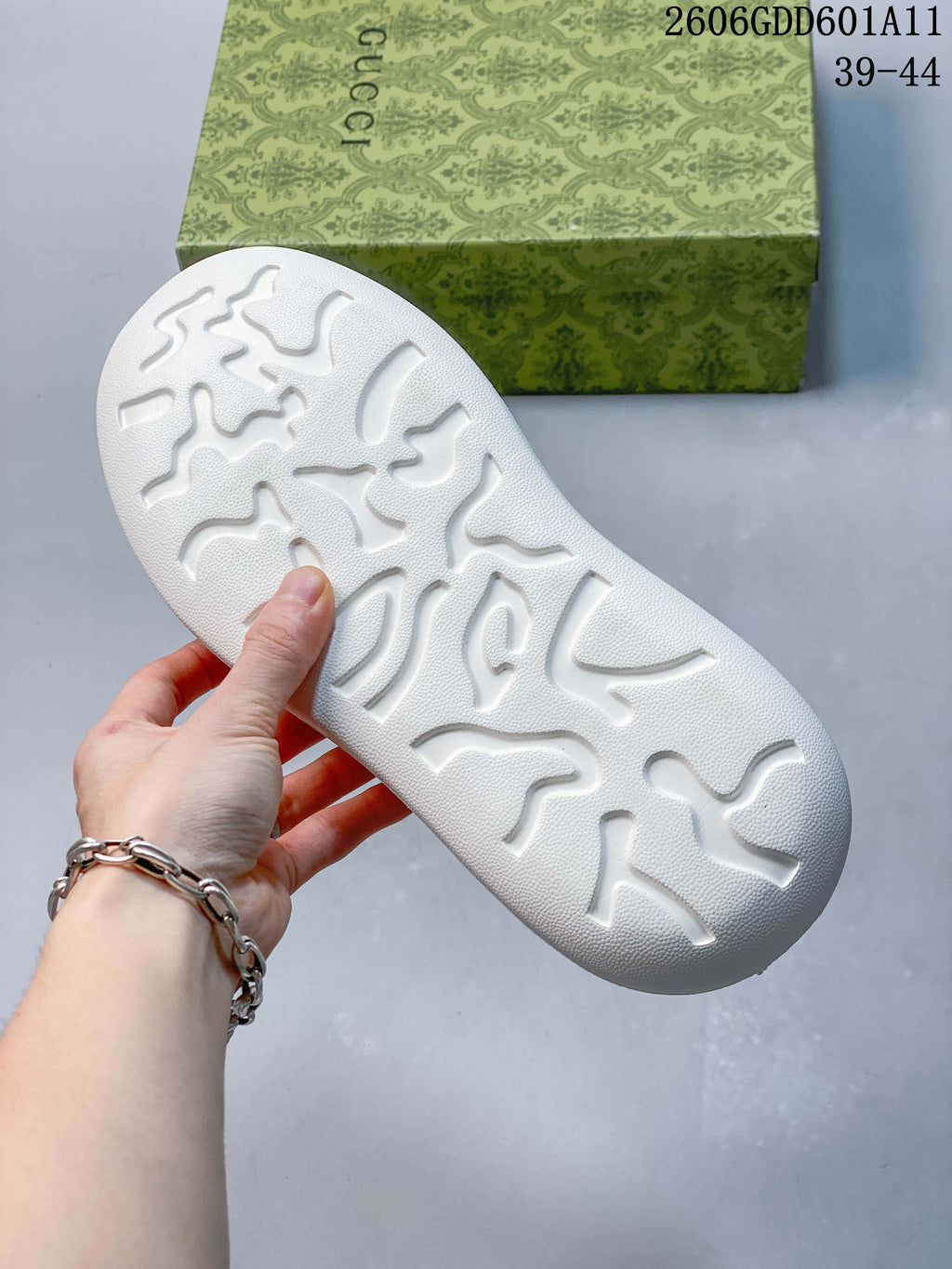 Close-up of the textured white outsole on the Gucci Screener GG sneakers.