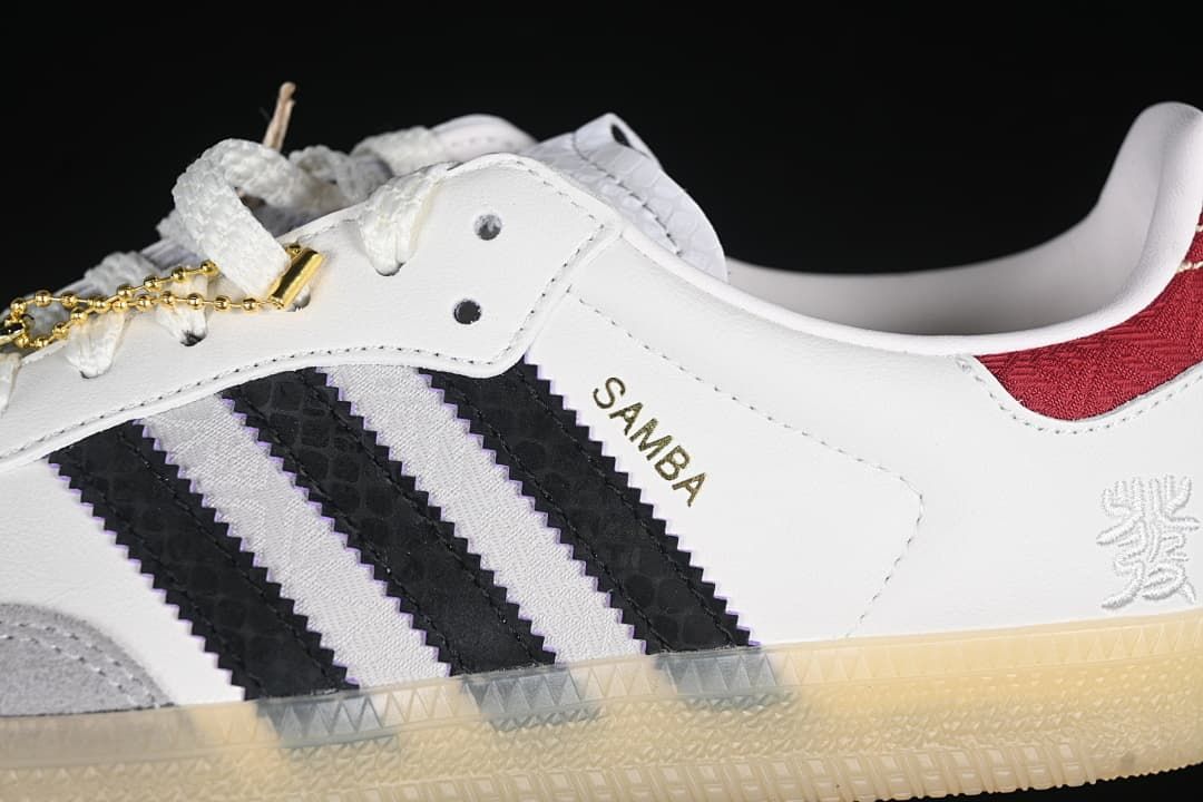 Close-up of Samba side branding, black stripes, gray overlay, and red heel accent