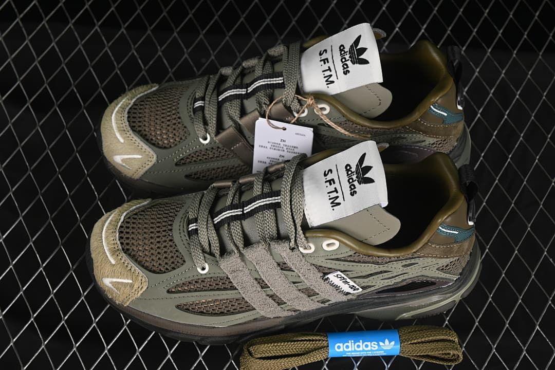 Pair of olive-toned sneakers shown from above with spare laces.