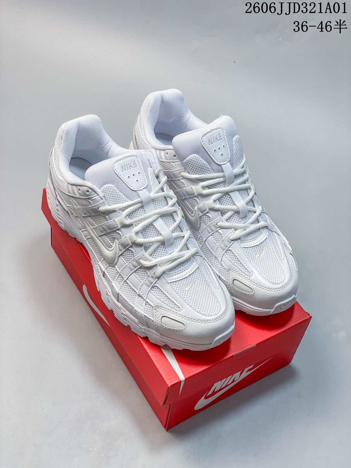Pair of white Nike P-6000 sneakers displayed on a red shoe box