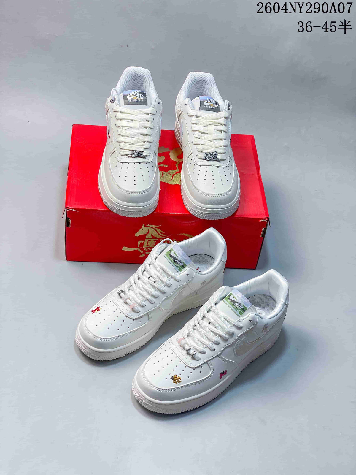 Several views of white low-top sneakers with different decorative motif and accent variations.