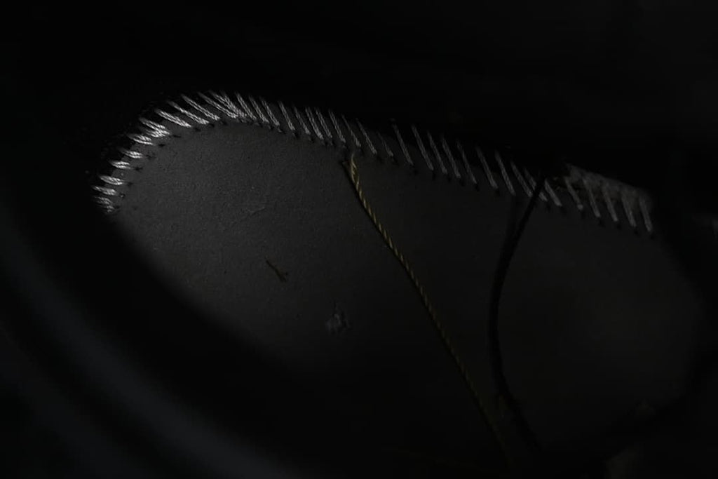 Dark outsole stitching detail