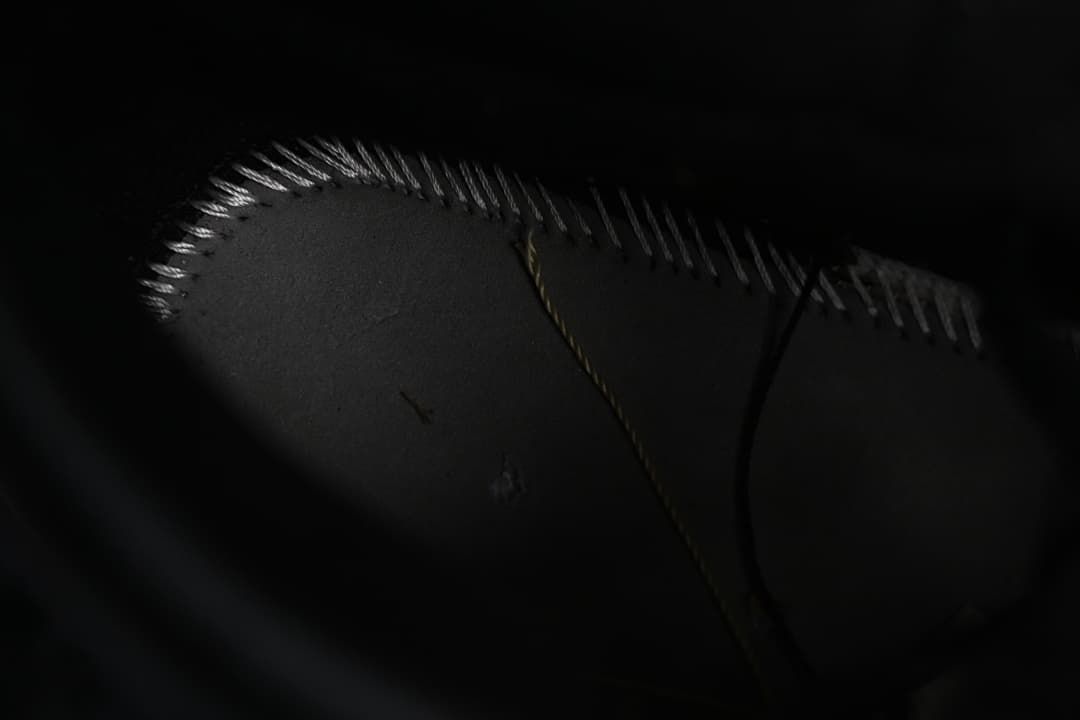 Dark outsole stitching detail
