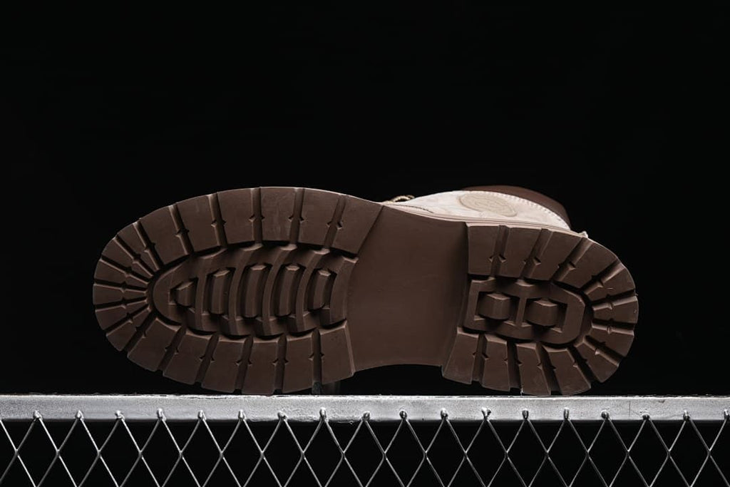 Underside view of a boot showing the deep lug tread pattern