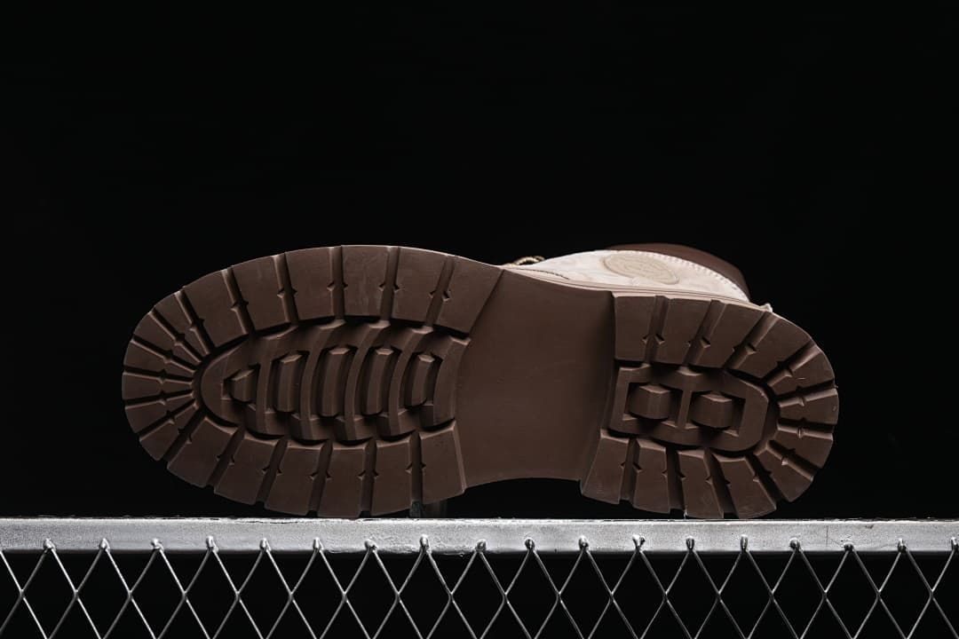 Underside view of a boot showing the deep lug tread pattern