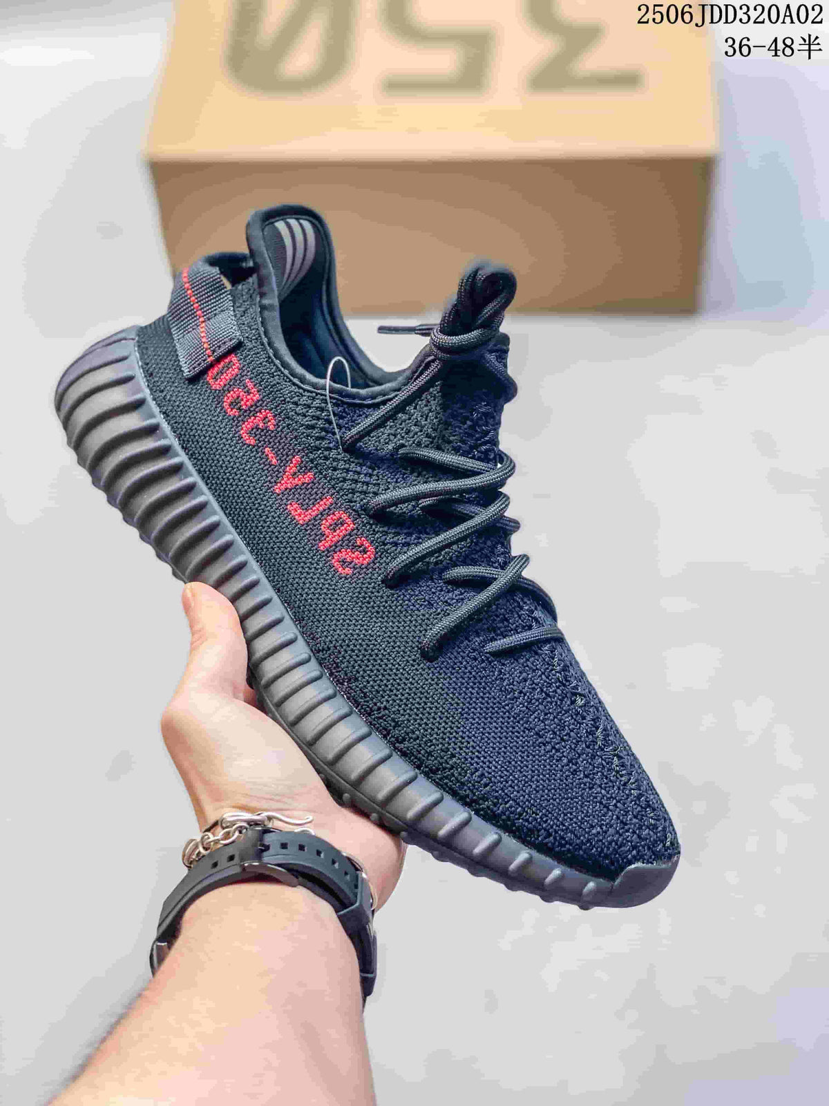 Dark knit-look Adidas Yeezy-style sneaker with a ribbed dark sole and red side lettering