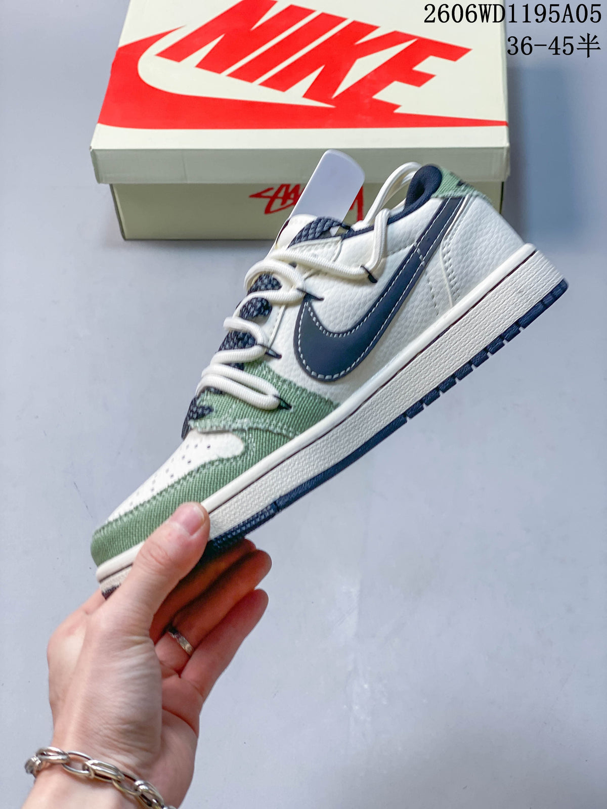 Side view of the sneaker with a dark navy side panel and green overlays